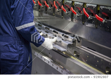 The operator working with hydraulic press brake bending machine. 91902807