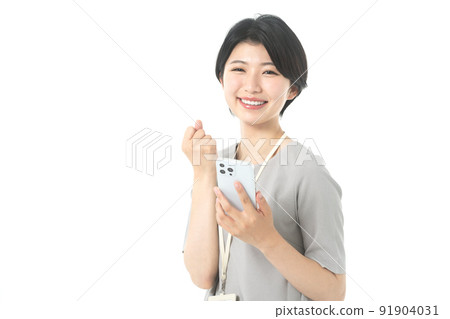 Female engineer in a young casual costume operating a smartphone (white background) Female engineer in a young casual costume operating a smartphone (white background) 91904031