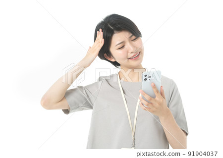 Female engineer in a young casual costume operating a smartphone (white background) Female engineer in a young casual costume operating a smartphone (white background) 91904037