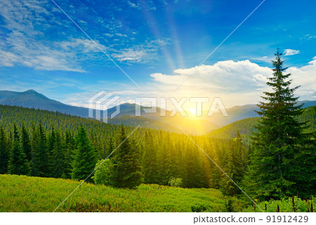 Picturesque sunrise on background of high mountains Picturesque sunrise on background of high mountains 91912429