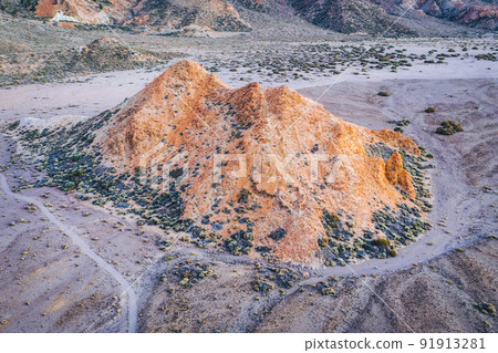 Nature Landscape view of the dry desert and rugged rocky volcanic mountains. Hardened lava, devastated valley. Sparse vegetation. Tenerife. Teide National park. Canary Islands, Spain Nature Landscape view of the dry desert and rugged rocky volcanic mountains. Hardened lava, devastated valley. Sparse vegetation. Tenerife. Teide National park. Canary Islands, Spain 91913281