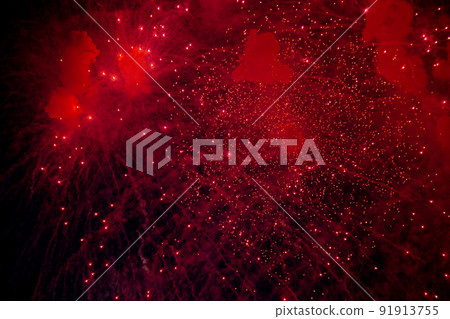 A bright firework with a red glowing center with red sparks and smoke flying towards the background of the night sky. High quality photo A bright firework with a red glowing center with red sparks and smoke flying towards the background of the night sky. High quality photo 91913755