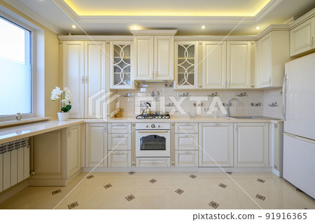 Classic white and beige large luxurious kitchen in studio apartment 91916365