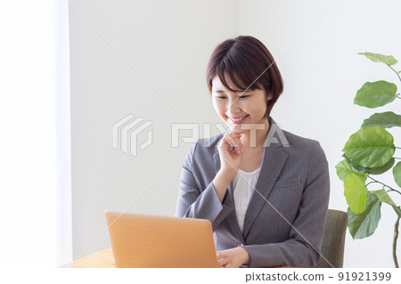 business woman wearing a suit business woman wearing a suit 91921399