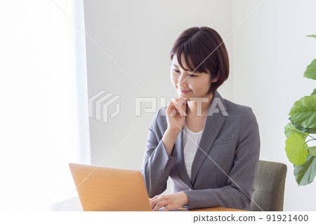 business woman wearing a suit business woman wearing a suit 91921400