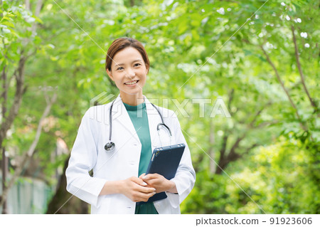 Doctor, medical worker, female, green background 91923606