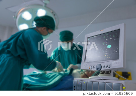 Electrocardiogram display in hospital surgery operating emergency room showing patient heart rate. 91925609