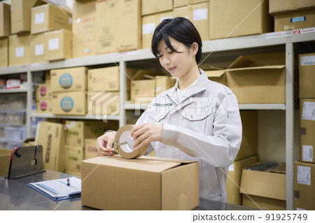 Business scene: A woman shipping in a warehouse Business scene: A woman shipping in a warehouse 91925749