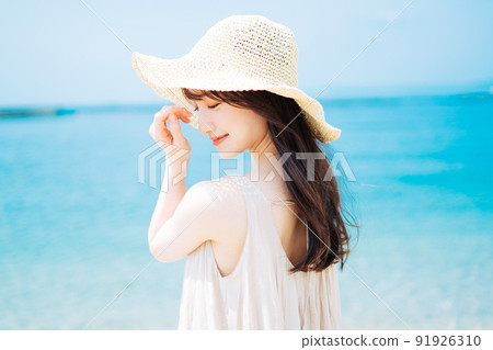 Blue sea and young woman 91926310