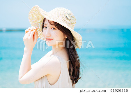 Blue sea and young woman 91926316