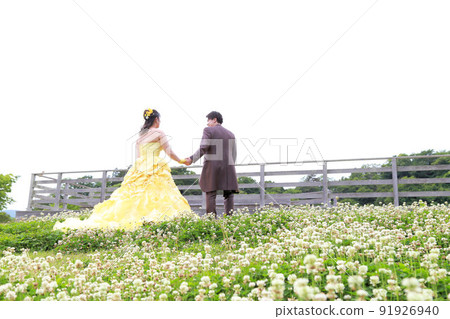 Photo wedding dress for bride in yellow cocktail dress and groom in brown tie Photo wedding dress for bride in yellow cocktail dress and groom in brown tie 91926940