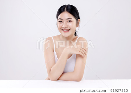 Beautiful young Asian woman with clean fresh skin on white background. 91927310