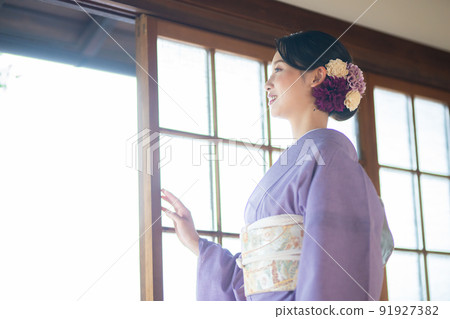 Young woman in summer kimono Young woman in summer kimono 91927382