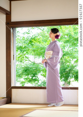 Young woman in summer kimono Young woman in summer kimono 91927387