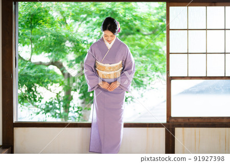 Young woman in summer kimono Young woman in summer kimono 91927398