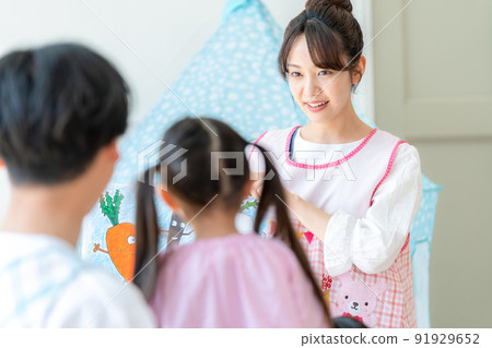 Nursery teacher playing picture-story show 91929652