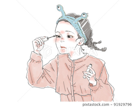 A woman applying mascara 91929796