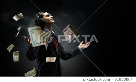Young businessman with headphones . Mixed media 91930064