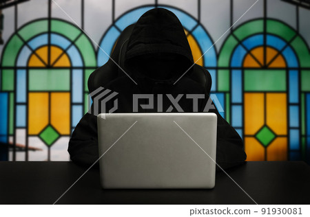 Hacker using computer with digital interface while sitting at desk of blurry interior. Hacking and thief concept. Hacker using computer with digital interface while sitting at desk of blurry interior. Hacking and thief concept. 91930081
