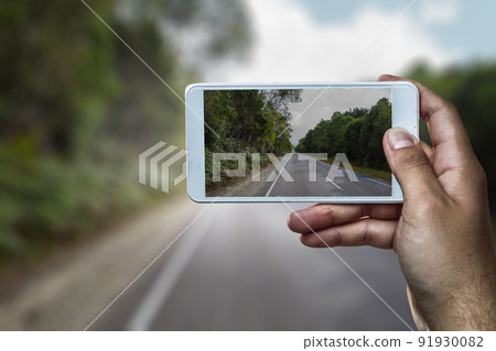 Hand holding smartphone mobile . Mixed media Hand holding smartphone mobile . Mixed media 91930082