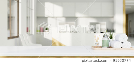 Copy space on the white tabletop over blurred spa or hotel lobby in the background Copy space on the white tabletop over blurred spa or hotel lobby in the background 91930774