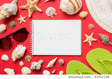 Blank writing book with summer beach accessories on background, copy space. Flat lay with copy space 91932186