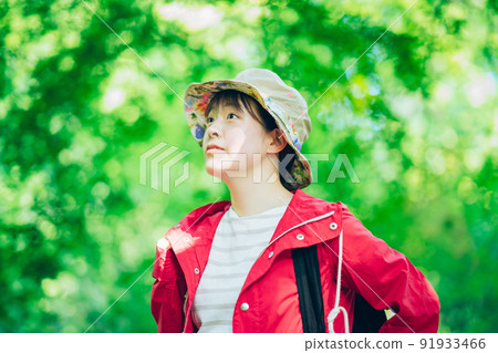 Woman walking in the fresh green mountains 91933466