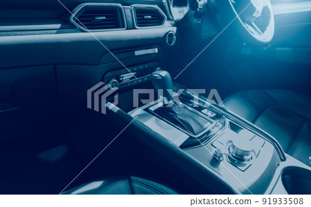 Luxury modern car interior. Inside the car with modern design. Automatic gear stick. Black comfort leather seats of a new car. Leather cockpit. Gearbox, steering wheel, dashboard, climate control knob 91933508