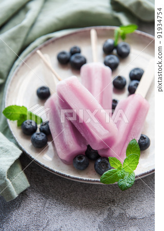 Homemade blueberry ice cream or popsicles 91934754