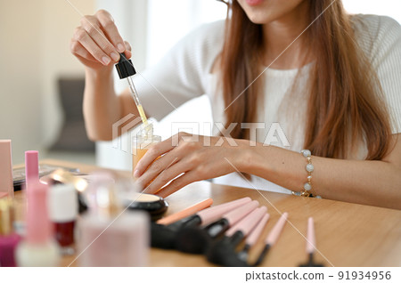 Charming female beauty testing her product skincare, making a beauty video content. Charming female beauty testing her product skincare, making a beauty video content. 91934956
