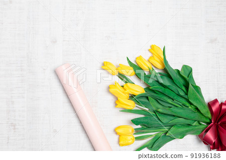 Flowers: Yellow tulips and flat image of diploma tube 91936188