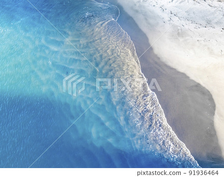 A resort-like sea and sandy beach captured from a bird's-eye view A resort-like sea and sandy beach captured from a bird's-eye view 91936464