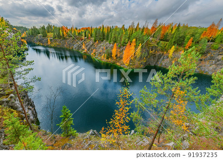 Lake in the deep marble canyon. Ruskeala Mountain Park. Republic of Karelia. Lake in the deep marble canyon. Ruskeala Mountain Park. Republic of Karelia. 91937235