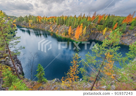 Lake in the deep marble canyon. Ruskeala Mountain Park. Republic of Karelia. Lake in the deep marble canyon. Ruskeala Mountain Park. Republic of Karelia. 91937243