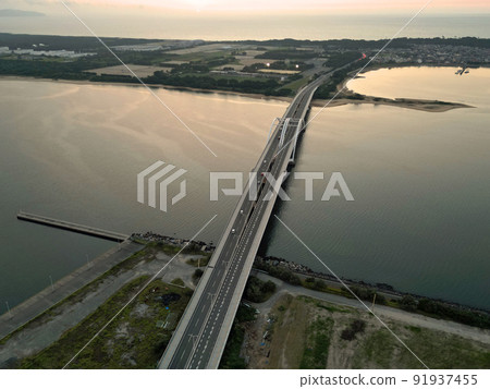 Aerial view of Uminonakamichi Bridge at dusk 91937455