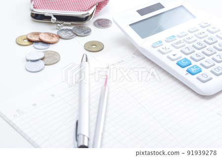 Image of managing household budget with calculator and household account book 91939278