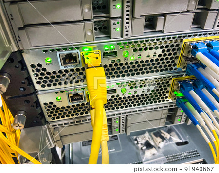 Network equipment with green lights working in a data center Network equipment with green lights working in a data center 91940667