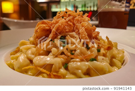 homemade South German pasta, baked with cheese, onions and garlic homemade South German pasta, baked with cheese, onions and garlic 91941143