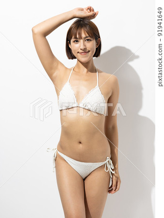 Beautiful woman in a swimsuit 91941649