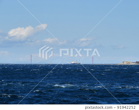 Cargo ship crossing the strait , 1915 Canakkale Bridge in background 91942252