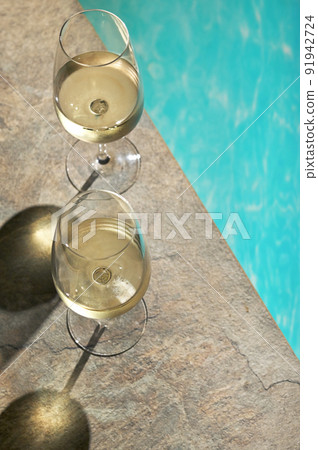 Summer White Wine Glass near pool Summer White Wine Glass near pool 91942724