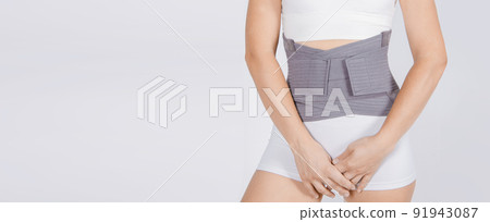Lumbar brace on the human body isolated on a white background. Trauma of back. Back brace, orthopedic lumbar, support belt for back muscles. Lower back problems health. Lumbar brace on the human body isolated on a white background. Trauma of back. Back brace, orthopedic lumbar, support belt for back muscles. Lower back problems health. 91943087