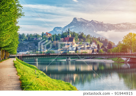 Salzburg sunset light and reflection of the city in warm lights. Austria 91944915