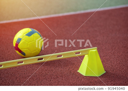 Soccer training equipment on green artificial turf. Material for trainning class of football academy. 91945040
