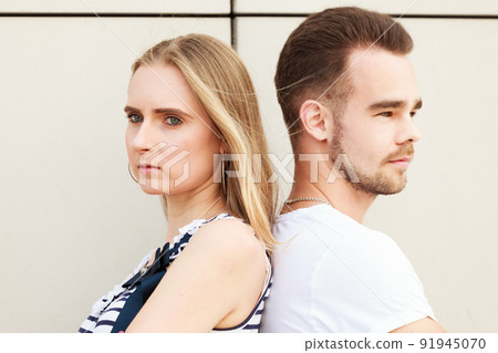 Couple not talking, standing back to back Couple not talking, standing back to back 91945070