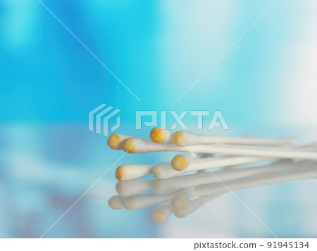 Used ear cotton swabs isolated on blurry background. Hygiene and health care. Close-up 91945134