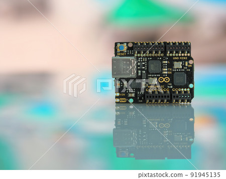 View of the new Arduino UNO Mini Limited Edition board isolated on blurry background 91945135