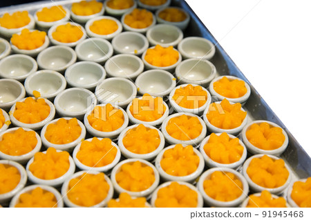 Egg yoke fudge balls cooked in syrup, Thai dessert, focus selective. Egg yoke fudge balls cooked in syrup, Thai dessert, focus selective. 91945468