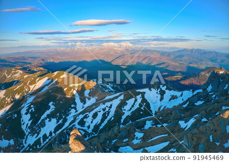 Aerial view over Ciucas Mountains, Ciucas Peak, Romania, Europe. Morning light at sunrise 91945469