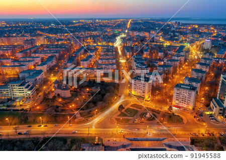 Aerial view of Galati City, Romania. Danube River near city with sunset warm light Aerial view of Galati City, Romania. Danube River near city with sunset warm light 91945588
